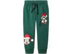 Žalios sportinės kelnės su kalėdiniais Mikio ir Gufio personažais bei užrašu „Christmas Crew“.