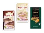 Tre chokoladebarer: to Pishmanya Angel Curls med bomuldsslik og en J.D. Gross Dubai Style med pistacie.