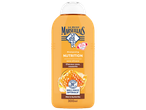 Bouteille de shampoing orange pour cheveux secs et cassants, à base de miel et karité bio, 300ml.