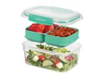 Three-tier lunch box with salad, strawberries and almonds.
