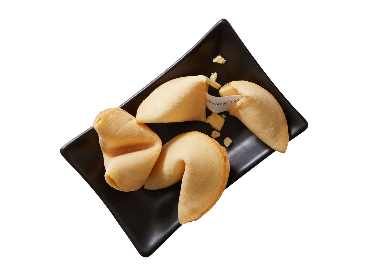 Three fortune cookies on a black rectangular plate, one is open revealing a fortune.