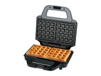 Open waffle maker with two golden-brown square waffles inside, ready to eat.