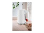 White electric kettle with a textured pattern on a wooden kitchen countertop.