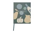 A recipe journal with a dark green cover featuring illustrations of fruits, vegetables, and a bottle.