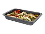 Roasting pan filled with roasted vegetables including fennel, bell peppers, carrots, and zucchini.