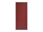 A rectangular red mat with a repeating geometric spiral pattern.