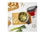 Overhead view of a Morphy Richards Saute & Soup Compact soup maker with ingredients like leeks, potatoes, and garlic.