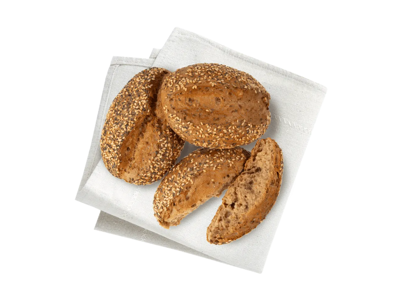 Drei Vollkornbrötchen mit Sesam und Mohn auf einem weißen Leinentuch.