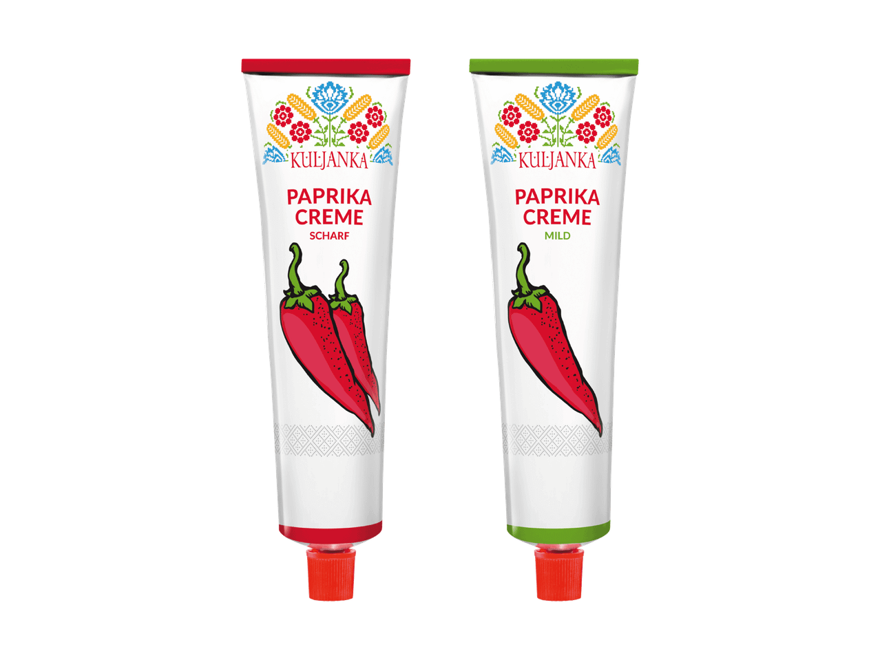 Zwei Tuben Paprikacreme, eine scharf mit zwei roten Chilischoten und eine mild mit einer roten Chilischote.