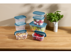 SILVERCREST® Food Storage Container Set with various foods on a wooden table.