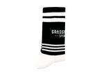 Black and white striped sports sock with text detail.