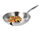 Stainless steel frying pan with cooked fish and vegetables