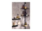 Black shower caddy with various bath products, including bottles, a brush, and a loofah.