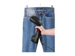 Handheld garment steamer used on blue jeans hanging on a clothes hanger.