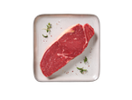 Bife Angus Rib Eye fresco DELUXE com ervas e especiarias num prato.