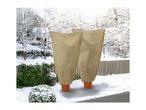 Two plant covers on a snowy patio with a winter landscape in the background