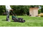 Man mowing lawn with a Parkside® Petrol Lawnmower in a garden