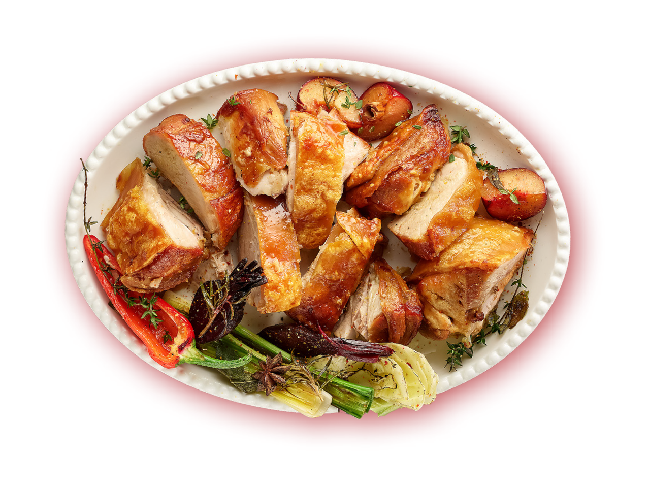 Pečena piletina s povrćem i voćem na bijelom pladnju
