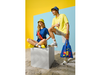 Two models wearing Lidl-branded clothing, including a bum bag, bucket hats, and socks, on a sandy set.