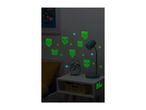 Minecraft glow-in-the-dark wall stickers decorate a child's bedroom.