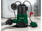 A green and black submersible pump with a float switch on a wet concrete floor, with a washing machine in the background.