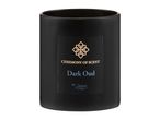 Black candle in a jar with a label reading 'CEREMONY OF SCENT Dark Oud BY Deluxe'