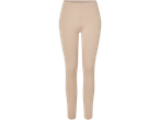 Beige leggings mot svart bakgrund.