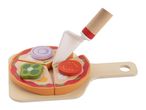 Wooden toy pizza with toppings and a pizza cutter on a cutting board.