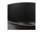 Close-up of a black, cylindrical container with measurement markings.