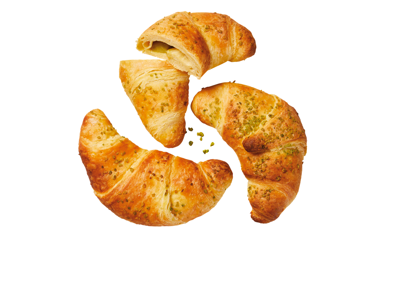 Trei croissante cu pistacii aranjate într-un cerc pe un fundal negru.