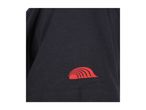 Close-up of a black t-shirt sleeve with a red wave-like logo.