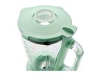 Green blender with a clear glass jar and measurement markings, viewed from above.