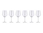 Six clear stemmed wine glasses arranged in a row on a white background.