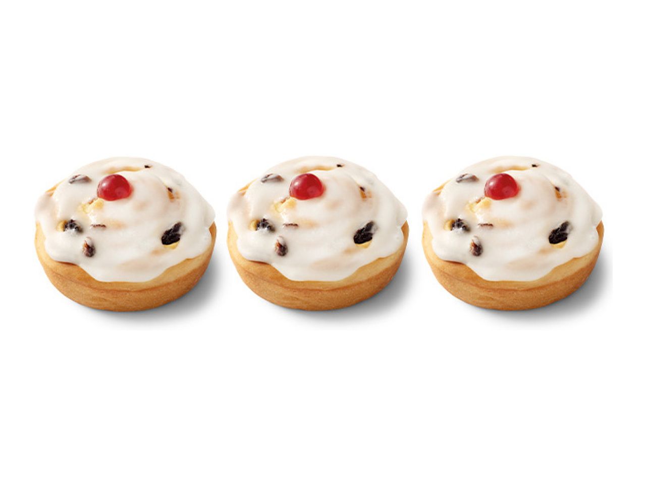 Three iced fruit buns with a cherry on top, arranged in a row.