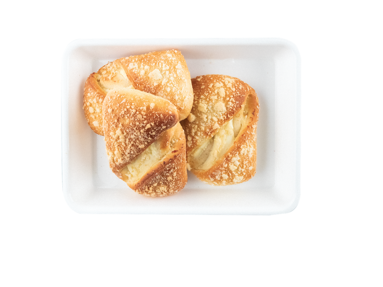 Pyragaičiai su trupiniais baltame padėkle.