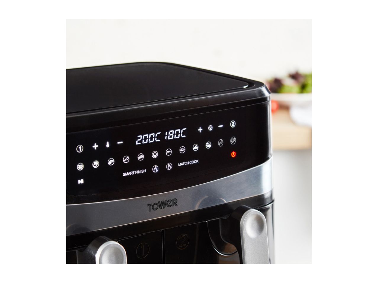 A black Tower air fryer with a digital display showing temperature settings.