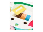 Close-up of a colorful wooden toy ice cream cart with various toppings and shapes.