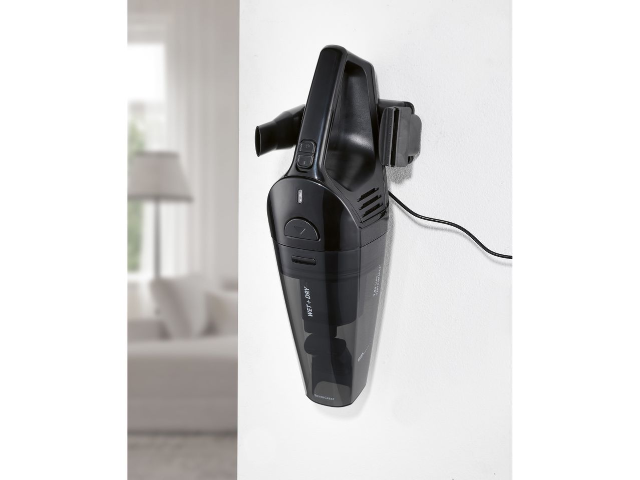 A SILVERCREST® Cordless Hand-Held Vacuum Cleaner mounted on a white wall
