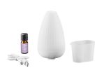 White essential oil diffuser with lavender oil, USB cable, and measuring cup.