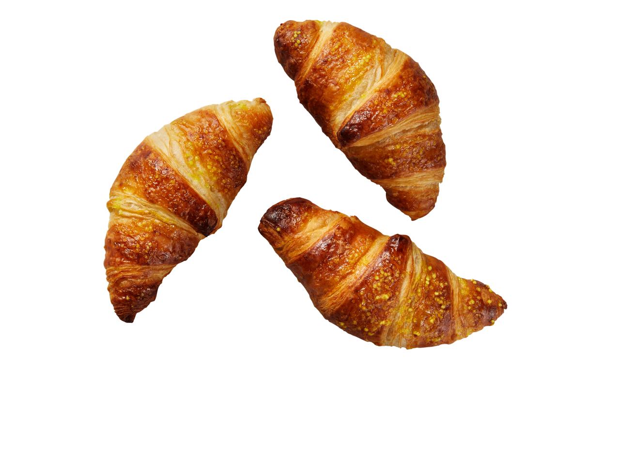 Auksiniai kruasanai, pabarstyti geltonais rutuliukais.