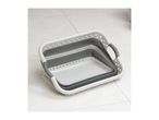 Three collapsible laundry baskets nested together on a tiled floor.