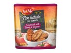 Crispbreads with tomato and oregano in a bowl, with fresh tomatoes and a village background.