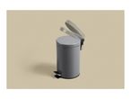 Grey pedal bin with an open lid on a light beige background