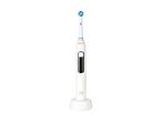 White electric toothbrush with a blue and green brush head on a charging base.