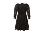 Black dress with white collar and cuffs, featuring skull and spiderweb patterns on the sleeves and skirt.