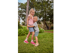 Two happy children wearing Lupilu T-shirts and shorts, hugging in a garden.