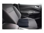 Black car seat cushion on a grey car seat with white stitching.