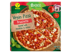 Pizza vegană Bruschetta Vēmondo, cu roșii și ceapă.
