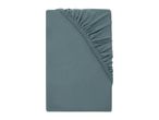 Folded teal fitted sheet with elasticated corners