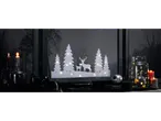 LIVARNO home LED Window Decoration with deer and trees, surrounded by candles and ornaments.